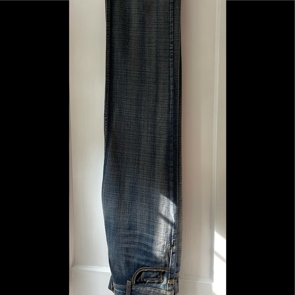 DKNY “Brooklyn” wide, straight-leg, loose-fit jean.
